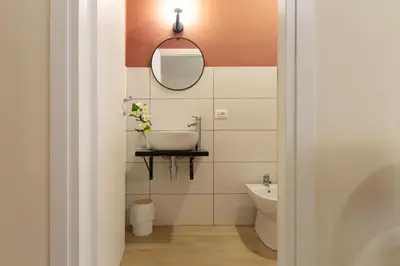 a bathroom with a sink and a mirror at Aureum Angelicum in Rome