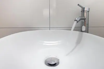 a white sink with a faucet in a bathroom at Aureum Angelicum in Rome