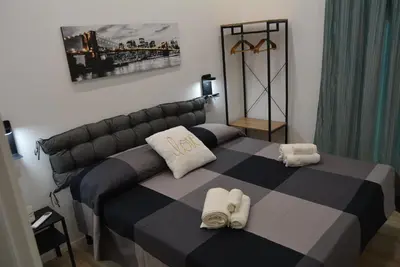 a bedroom with a bed with towels on it at Casa Amabile in Rome