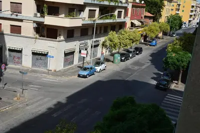 an overhead view of a city street with cars parked at Casa Amabile in Rome