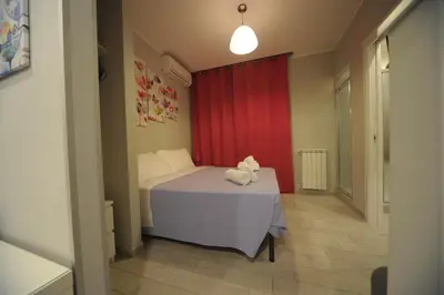 a bedroom with a bed with a teddy bear on a table at Bbrothershouse in Rome