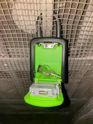 a green suitcase is sitting on a shelf at Green house in Rome