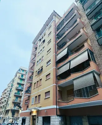 a tall building with balconies on the side of it at Appartamento Appio San Giovanni in Rome