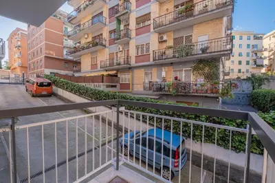 a balcony with a car parked in front of a building at Vatican Cozy - Casetta Vaticana in Rome