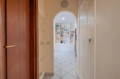 a hallway with an archway in a room at Vatican Cozy - Casetta Vaticana in Rome