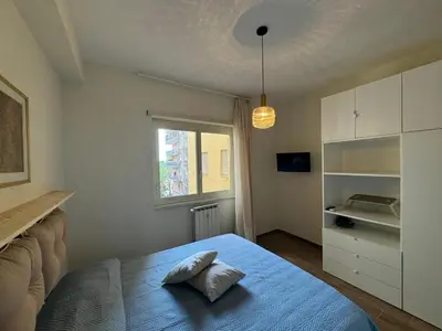 a bedroom with a bed with a pillow on it at Apt with balcony in Roman Quiet in Rome
