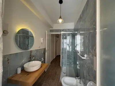 a bathroom with a tub and a sink and a shower at Apt with balcony in Roman Quiet in Rome
