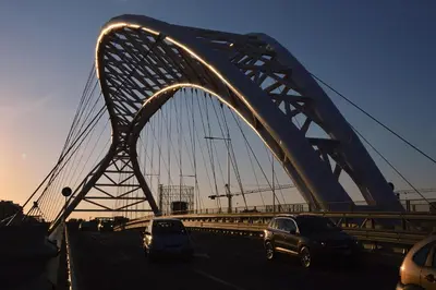 a bridge with cars driving on a highway at We Love It - BestBnB Garbatella in Rome