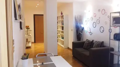 a living room with a couch and a table at We Love It - BestBnB Garbatella in Rome