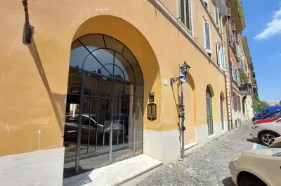 a building with a window with a car in it at MM Luxury Apartment in Rome