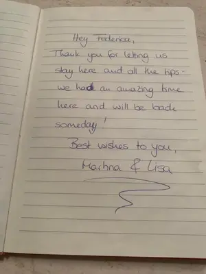 a piece of paper with handwriting on a notebook at Casa di Alfredo -Appartamento Musei Vaticani in Rome