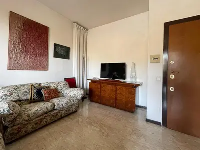 a living room with a couch and a flat screen tv at Casa di Alfredo -Appartamento Musei Vaticani in Rome
