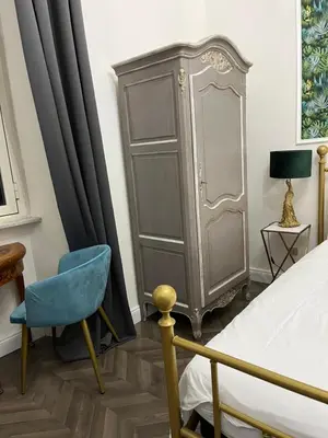 an empty room with a white wall and a hallway at Tiburtino Apartment in Rome