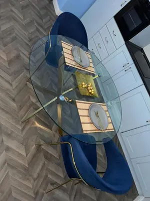 a kitchen with a glass table and two chairs at Tiburtino Apartment in Rome