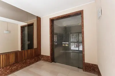 a hallway with a wicker fan on a wall at Aurelia 386 Vatican House in Rome