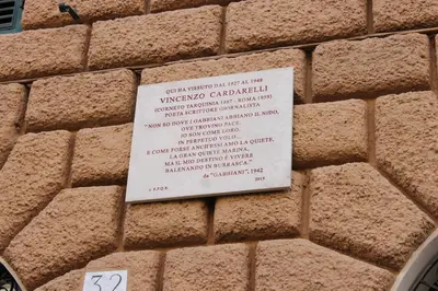 a sign on the side of a brick wall at Little Rose Residence in Rome