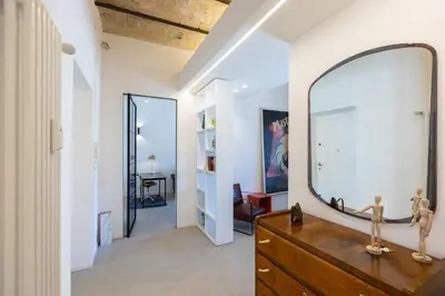 a mirror on top of a dresser in a room at Testaccio by Rental in Rome in Rome