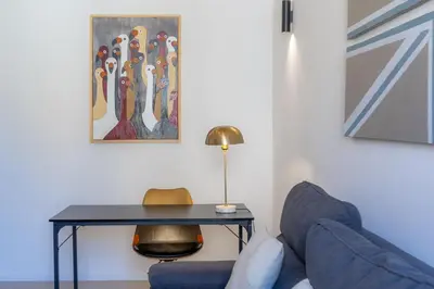 a living room with a blue couch and a table at Testaccio by Rental in Rome in Rome