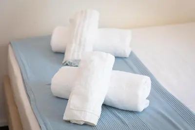 a group of rolled towels on a bed at Campani by Rental in Rome in Rome