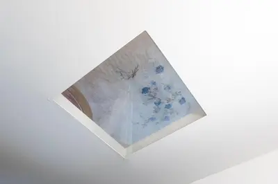 a painting of blue flowers on a white wall at Campani by Rental in Rome in Rome