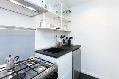 a kitchen with a stove and a sink at Campani by Rental in Rome in Rome