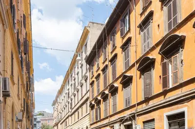 a row of buildings with windows on a street at Campani by Rental in Rome in Rome