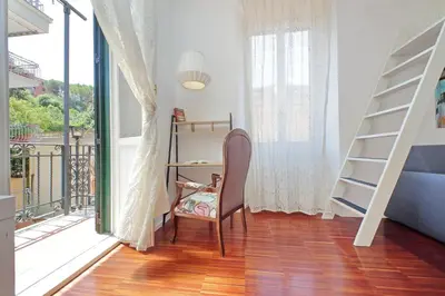 a room with a desk and a chair next to a window at 4BNB - Angelo Emo in Rome