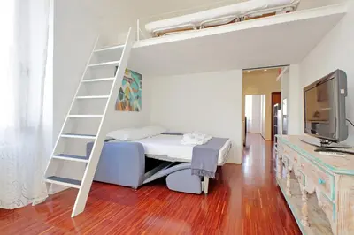 a bedroom with a bunk bed with a ladder at 4BNB - Angelo Emo in Rome