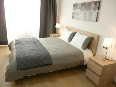 a bedroom with a large bed with white pillows at Atticoromantica in Rome