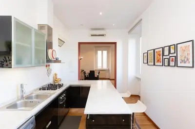 a kitchen with a sink and a counter top at Ripa by Rental in Rome in Rome