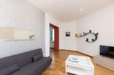 a living room with a couch and a tv at Ripa by Rental in Rome in Rome