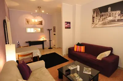 a living room with a couch and a table at Laura's Apartment Vatican in Rome