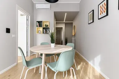 a dining room with a table and chairs at Del Frate Guest House Vatican in Rome