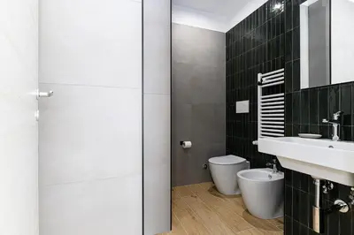 a bathroom with a sink and a toilet at Del Frate Guest House Vatican in Rome