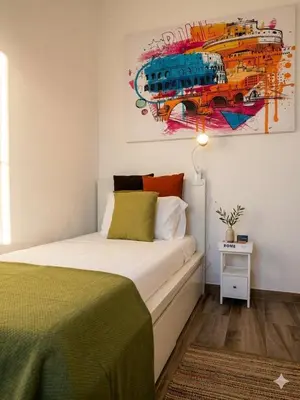 a bedroom with a bed with red and green pillows at Casa Domus Mea - garden addicted in Rome