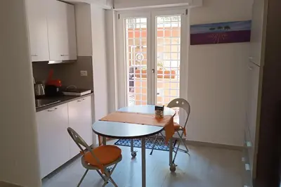 a kitchen with a table and chairs and a window at Vatican tiny house by Gialel in Rome