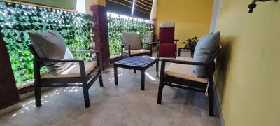 a group of chairs and a table in a room at Charming Apartment 367 in Rome