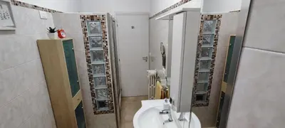 a bathroom with a sink and a toilet and a mirror at Charming Apartment 367 in Rome
