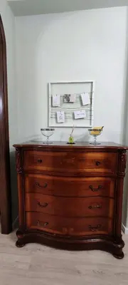 a wooden dresser with two bowls on top of it at Charming Apartment 367 in Rome