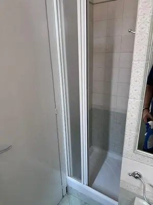 a shower with a glass door in a bathroom at LarisaSuite in Rome