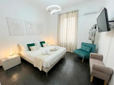 a bedroom with a bed with towels on it at Dream suite Modern in Rome Air Conditioning WiFi near the Metro A in Rome