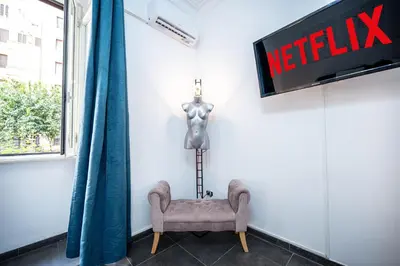 a white refrigerator with a tv on top of it at Dream suite Modern in Rome Air Conditioning WiFi near the Metro A in Rome
