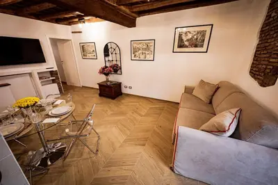 a living room with a couch and a table at Pantheon Appartamento Costaguti in Rome