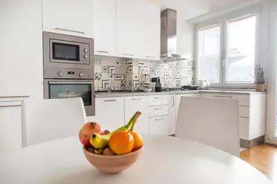 a bowl of fruit on a table in a kitchen at Casetta Pandosia - San Giovanni - Colosseo in Rome