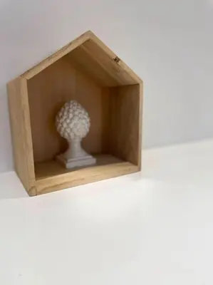 a small wooden box with a vase in it at MilleStorie House Rome in Rome