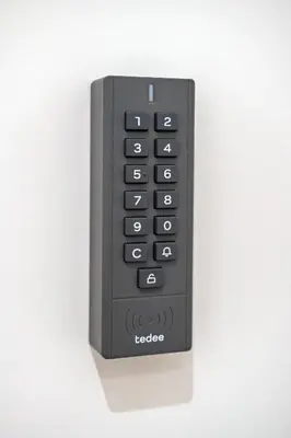 a black remote control attached to a wall at Relais Garbatella in Rome