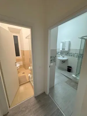 a bathroom with a shower and a toilet and a sink at San Paolo Apartment in Rome