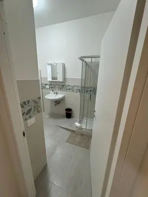 a bathroom with a shower and a sink at San Paolo Apartment in Rome