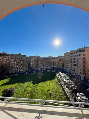 a view of a city from a balcony at Sunrise House - San Giovanni in Rome