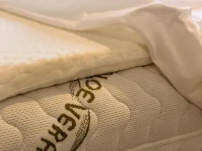 a close up of a white mattress with a football on it at Two Bedroom Appartment - 3 min Metro Conca D'Oro by ORPI RENT in Rome